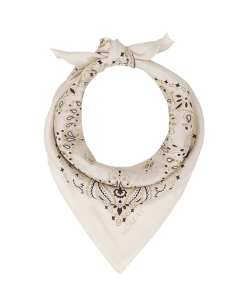 The Silk Bandana in cream by THE GREAT. F25 COLLECTORS features a lightweight silk paisley design, folded and knotted at the top, shown on a white background.