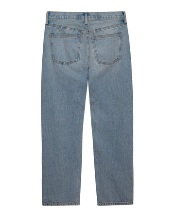 A pair of The Wayne Jean in Sedona Wash by THE GREAT. PF24, made from 100% cotton light blue denim with a straight cut and cropped hem, viewed from the back, showcasing two rear pockets and a waistband with belt loops.