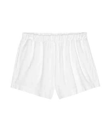 The Micro Terry Swing Short in True White by THE GREAT. SU25 MICRO TERRY features an elastic waistband and is shown against a black background.