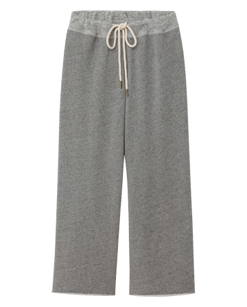 The Wide Leg Cropped Sweatpant in Varsity Grey by THE GREAT. CORE KNITS features a wide-leg design, a white drawstring waist, and is crafted from a soft, fleecy material.