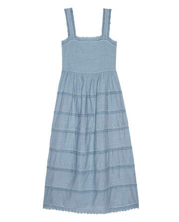 The Reverie Dress in Pale Blue by THE GREAT. PF25 features wide straps and lace detailing on the bodice and skirt, laid flat on a white background—a dreamy fashion statement.