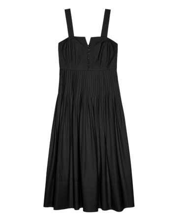The Day Break Dress by THE GREAT. SU25 in black features wide shoulder straps, button bodice detail, a fitted waist, and a pleated skirt.