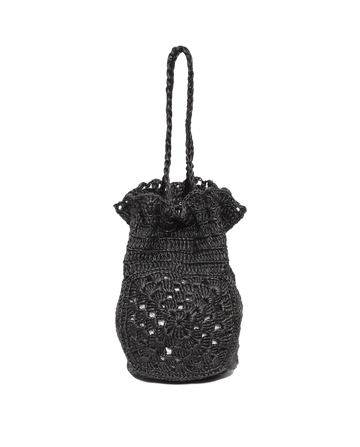 The Crochet Drawstring Bag by THE GREAT. SU23 is a black handmade piece with intricate patterns, crafted from agave plant fibers, featuring a round base and elegant texture.