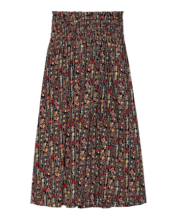 The Canary Skirt by THE GREAT. F25 D2 features a black, high-waisted, voluminous silhouette with pleats and a garland print in red, yellow, and green.