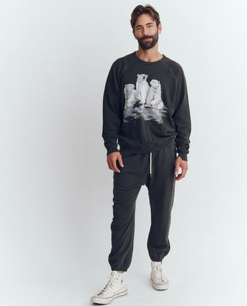 The Men's College Sweatshirt. Graphic -- Washed Black with Polar Bear Graphic SWEATSHIRTS THE GREAT. HOL 23 D1 MEN