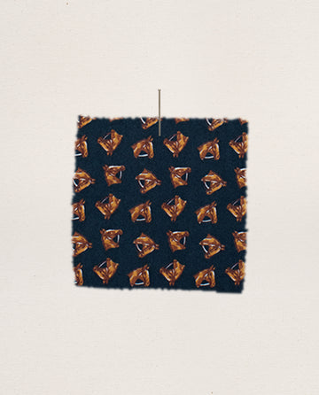 The Easy Sleep Pant by THE GREAT. F25 SLEEP, in a Navy Horse Medallion Print and made from 100% cotton, hangs against a plain light background.