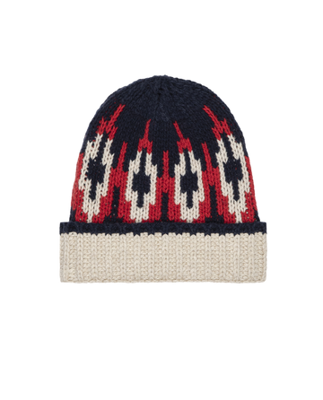 The Nordic Beanie – Glacier Fair Isle by THE GREAT. F25 TGO is a chunky wool beanie with a cream brim and a navy blue, red, and cream Fair Isle pattern across the crown.