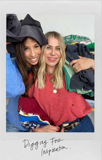 Two women smiling, holding stacks of folded clothes. One wears a red top and necklace, the other a blue top. Text below reads, "Digging For Inspiration.