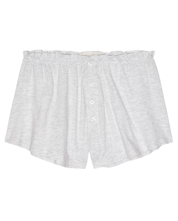 The Tap Short.. by THE GREAT. H25 SLEEP in Heather Grey features a gathered waistband, loose fit, button front, and ruffle detail—perfect for cozy nights in. Shown laid flat on a white background.