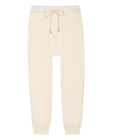 The Long John in Washed White by THE GREAT. H25 SLEEP: men's cream base layer pants with elastic waistband, drawstring, front fly, and cuffed ankles, shown on a white background.