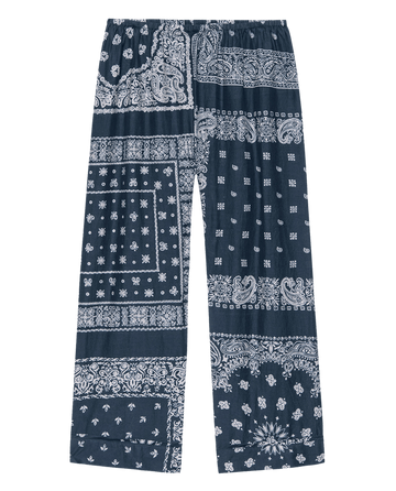THE GREAT. F25 SLEEP The Easy Sleep Pant—Bandana Patchwork: cotton wide-leg pants with blue and white paisley and floral bandana print, perfect for stylish lounging or sleep.