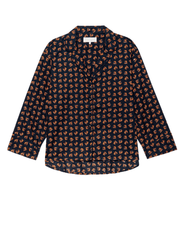 The Pajama Shirt by THE GREAT. F25 SLEEP features a navy base with an all-over orange horse medallion print, inspired by vintage long-sleeve cotton sleepwear.