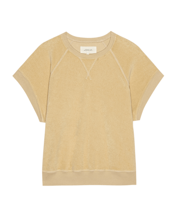 The Micro Terry Wedge Sweatshirt by THE GREAT. SU25 MICRO TERRY in Chamois is a beige short-sleeve crewneck made of soft, textured terry fabric, shown flat on a white background.