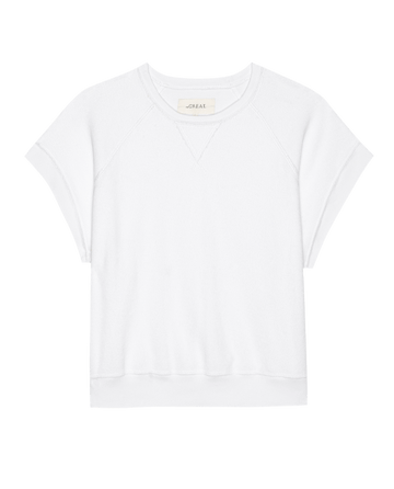 The Micro Terry Wedge Sweatshirt by THE GREAT. SU25 MICRO TERRY in True White features short sleeves, a crew neckline, visible stitching, and a straight hem, shown on a white background.