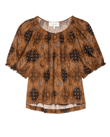 The Moorland Top by THE GREAT. F25 D1 is a short-sleeve pullover with a relaxed fit, featuring a brown and black geo bandana print, paisley details, gathered neckline, and elastic cuffs—a modern take on vintage style.