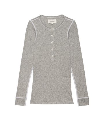The Baby Rib Henley in Heather Grey by THE GREAT. F25 BABY RIB is a vintage-inspired slim henley with long sleeves, white buttons, and white stitching, crafted from recycled cotton and shown laid flat on a plain background.