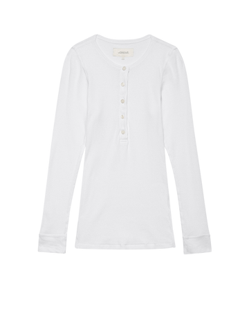 The Baby Rib Henley in True White by THE GREAT. F25 BABY RIB, features a vintage-inspired design with long sleeves, a round neckline, and a five-button placket, crafted from a recycled cotton blend and laid flat on a white background.