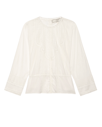 The Victorian Top by THE GREAT. F25 COLLECTORS is a vintage-inspired, long-sleeved white cotton voile blouse with intricate front embroidery, lace detailing, a round neckline, and flared cuffs, shown on a plain background.