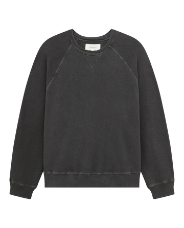 Here's an option rewritten using the given product data:
"The Slouch Sweatshirt in solid washed black by THE GREAT. CORE KNITS is a vintage-inspired, long-sleeve crew neck made in the U.S.A. from 100% cotton, without any visible branding.