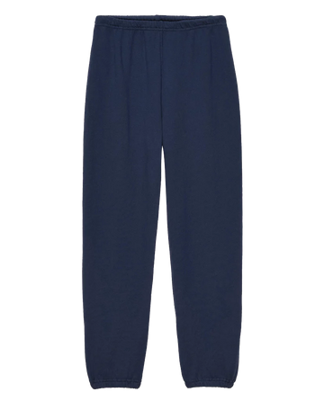 A pair of The Stadium Sweatpant. Solid -- True Navy from THE GREAT. FALL 23 KNITS, featuring an elastic waistband and elastic cuffs at the ankles, reminiscent of vintage athletic wear, displayed on a plain white background.