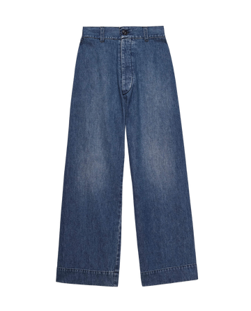 Introducing The Seafair Jean in Marina Wash by THE GREAT. PF24: blue denim jeans with an ultrahigh waist, wide legs, and a buttoned waistband, elegantly displayed against a white background.