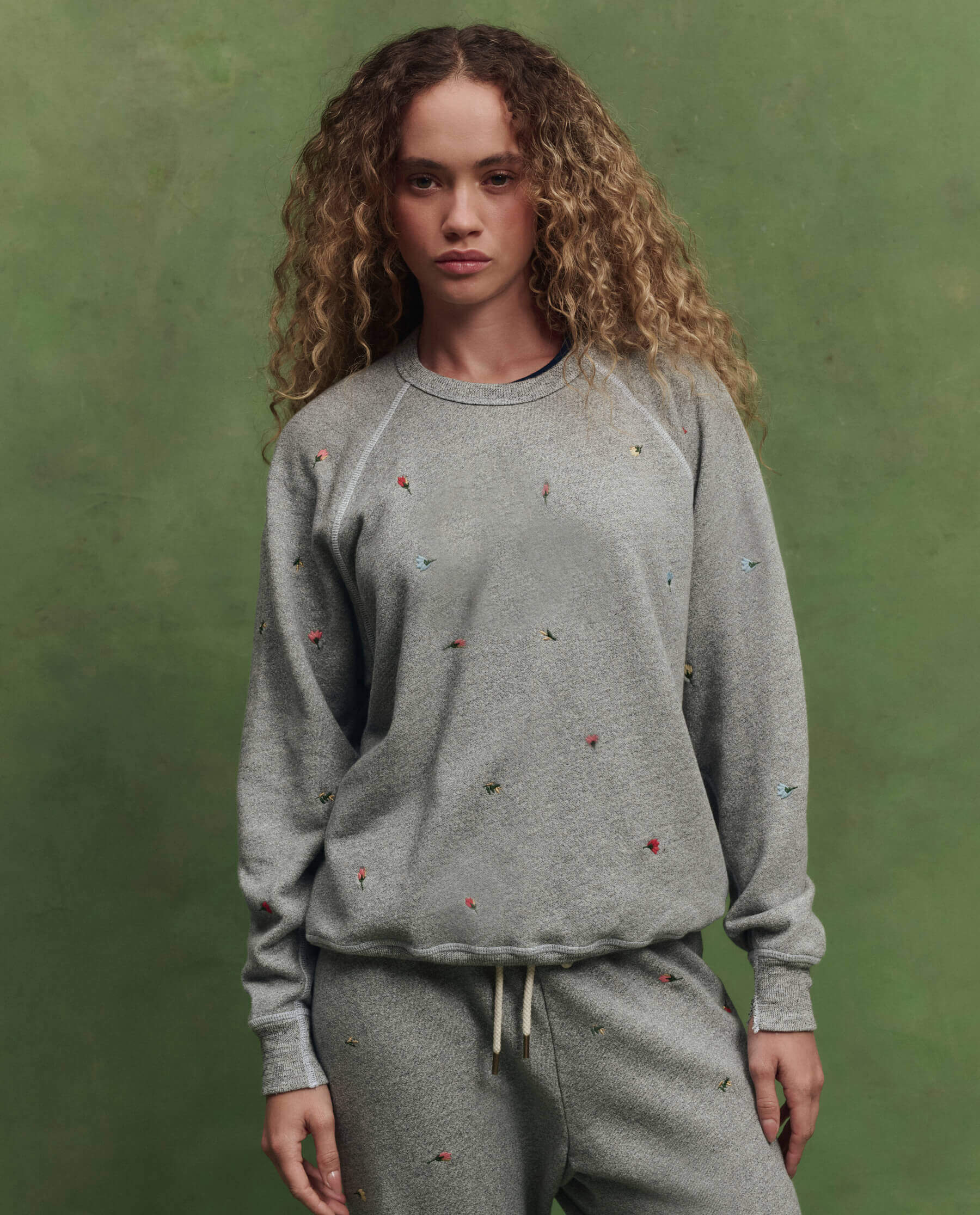 The College Sweatshirt w/ Tossed Floral Embroidery. -- Varsity 