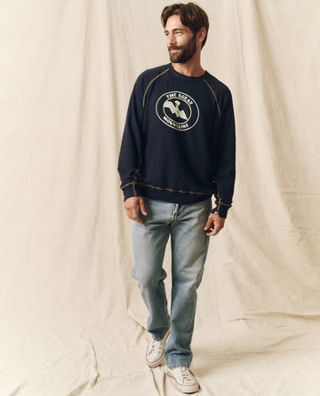 The Men's College Sweatshirt. Graphic -- Stargazer Blue with Mountain Resort Graphic SWEATSHIRTS THE GREAT. SP24 MEN