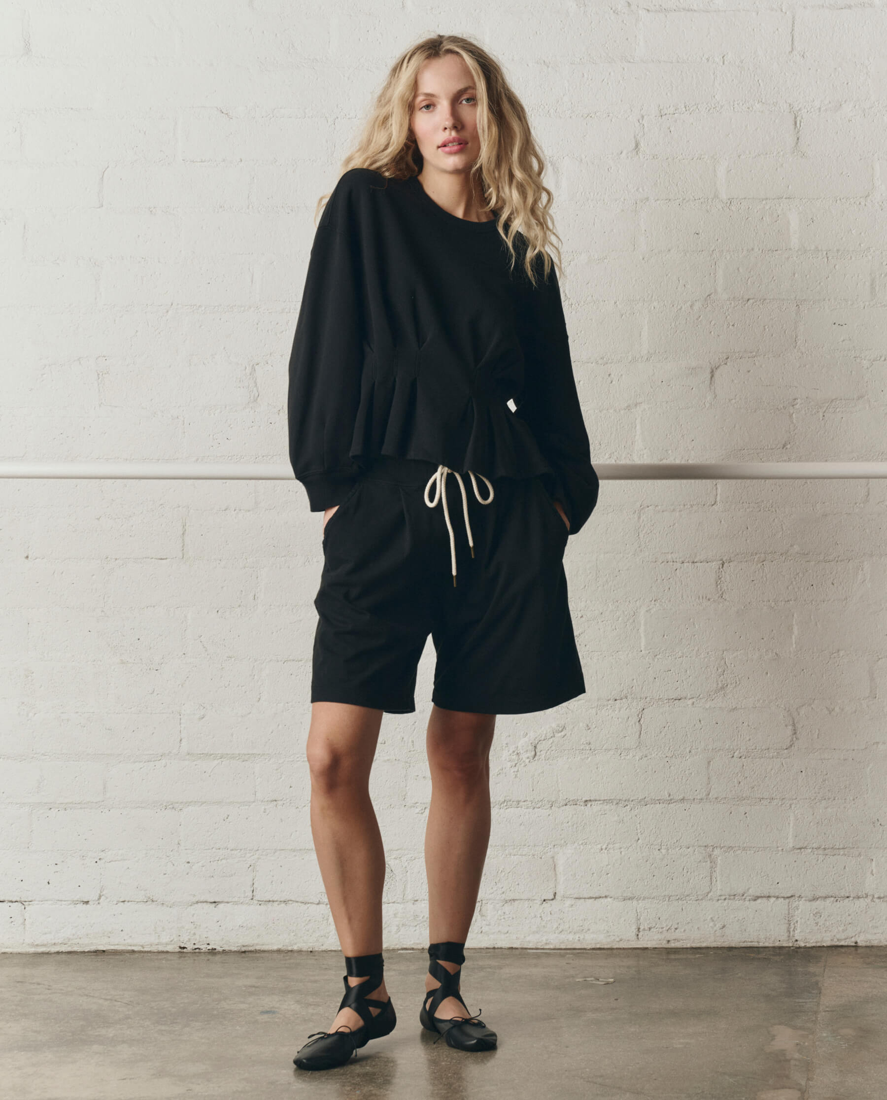 The Slouchy Corset Sweatshirt. -- True Black – The Great.