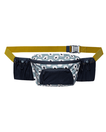 The Adventure Hip Pack by THE GREAT. SP25 TGO in Falling Daisy Multi combines style and function with a central zipped pouch, two side pockets, and an adjustable yellow strap with black clips—ideal for your next adventure.