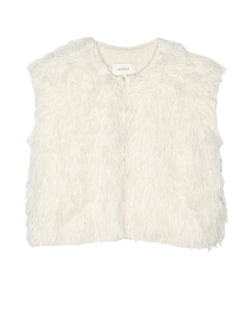 A sophisticated soft white Boucle Loop Vest by THE GREAT. HOL 24 set against a simple black background, seamlessly combining style with grace.