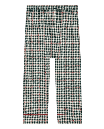 Introducing The Pajama Pant in Winter Pine Plaid by THE GREAT. HOL 24 SLEEP. These stylish pajama pants feature a black, white, and red checkered pattern set against a sleek black background, making them perfect for nightwear. Enjoy the comfort of an elastic waistband for a great fit.