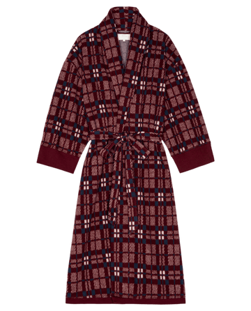 The Plush Fleece Robe in Fireside Plaid, by THE GREAT. HOL 24 SLEEP, features a shawl collar and tied belt, and is displayed flat on a black background.