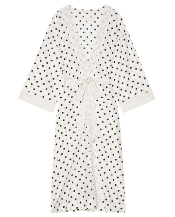 The Robe, by THE GREAT. PS25 SLEEP, is a luxurious cream mixed polka dot kimono-style bathrobe featuring long sleeves and a matching tie belt.