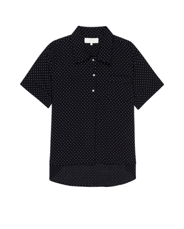 The Short Sleeve Pajama Shirt by THE GREAT. PS25 SLEEP features mini black polka dots and a front pocket on the left side.