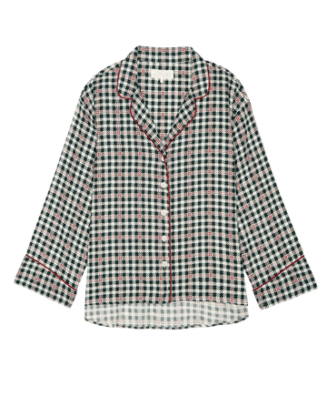 Introducing The Pajama Shirt in Winter Pine Plaid from THE GREAT. HOL 24 SLEEP, a cozy loungewear piece showcasing a button-up design with a black, green, and white checkered pattern highlighted by red piping.