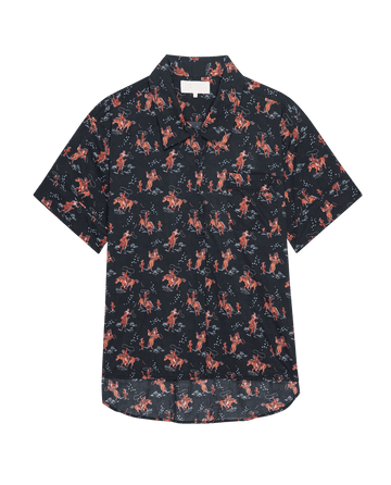 The Short Sleeve Pajama Shirt by THE GREAT. SP25 SLEEP features a navy background with an all-over red and tan cowboy print.