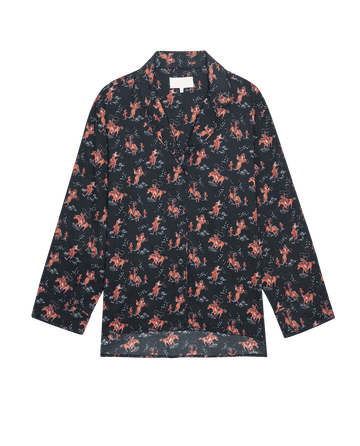 The Pajama Shirt. -- Navy Cowboy by THE GREAT. SP25 SLEEP is a stylish long-sleeve, button-up sleep shirt featuring a navy base with an all-over cowboy print—perfect for chic sleepwear.