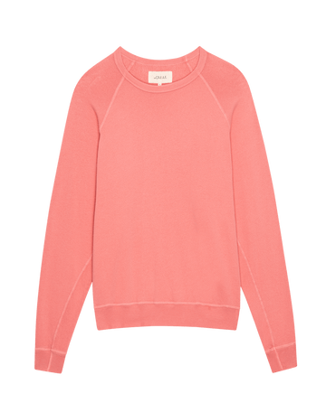 A pink long-sleeve college sweatshirt from THE GREAT. SP25 KNITS, featuring a round neckline, laid flat against a white background; "The College Sweatshirt. Solid -- Confetti.