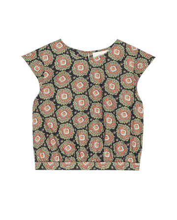 The Midland Top -- Heirloom Paisley by THE GREAT. SP25 D2 is a sleeveless piece featuring a bold black backdrop with colorful circular patterns in vibrant red, orange, and green, perfect for enhancing any women's wardrobe.