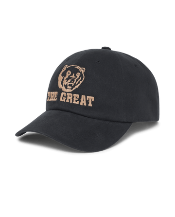 THE GREAT. F25 D1 ACCESSORIES The Baseball Hat. Graphic -- Black features a bear graphic and "THE GREAT" in beige chainstitch embroidery on the front, plus an adjustable back for a comfortable fit.