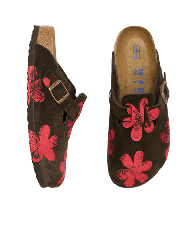 The Hand Stamped Boston Birkenstock clogs by THE GREAT. HOL 24 BIRKENSTOCK in mocha with a hot red daisy pattern, featuring elegant side and top views and adjustable buckles.