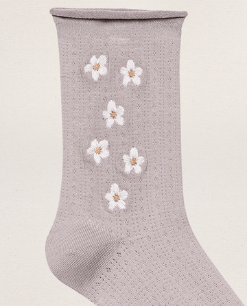 THE GREAT. SP25 POINTELLE SOCKS—The Pointelle Sock in lavender, featuring vertical embroidery of five white daisies with yellow centers.