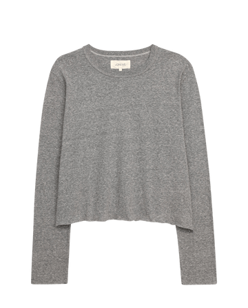 The Long Sleeve Crop Tee by THE GREAT. CORE KNITS in Heather Grey features a round neckline and long sleeves, ideal for layering. Its simple design contrasts beautifully with the white background.
