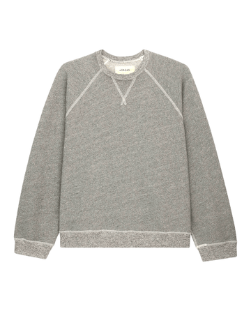 The Slouch Sweatshirt by THE GREAT. CORE KNITS in Varsity Grey showcases a vintage crewneck design with slouchy sleeves and ribbed cuffs and hem, elegantly displayed on a white background.