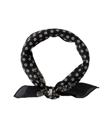 Introducing The Bandana - Small by THE GREAT. SP24 D2, in an Almost Black shade with white floral patterns, tied in a knot and crafted from 100% cotton for an ultra-soft feel, reminiscent of vintage handkerchiefs.
