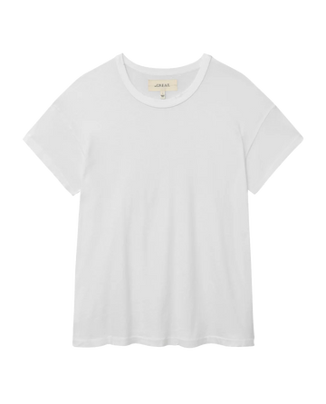 A plain white crew-neck t-shirt, crafted from 100% cotton, displayed on a white background. Product Name: The Boxy Crew. Solid -- True White from THE GREAT. CORE KNITS