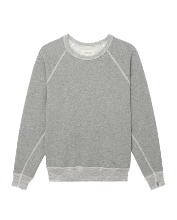 The College Sweatshirt in Varsity Grey by THE GREAT. CORE KNITS, an oversized piece featuring a crew neck and raglan sleeves, made from double washed terry fabric, is laid flat against a white background.
