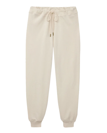 The Cropped Sweatpant in Washed White by THE GREAT. CORE KNITS, featuring a drawstring waistband and ribbed cuffs reminiscent of vintage gym pants, displayed against a white background.