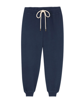 The Cropped Sweatpant in True Navy by THE GREAT. FALL 23 KNITS features a vintage gym style with a white drawstring and elastic cuffs at the ankles, meticulously handcrafted from 100% cotton.