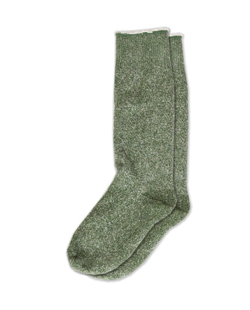 A pair of "The Sweatshirt Sock." in "Deep Pine" by THE GREAT. SP25 SWEATSHIRT SOCKS is laid flat against a white background, offering the perfect blend of style and comfort.